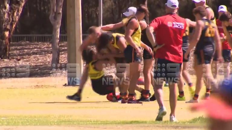 Crows duo separated after bruising tackle sparks heated bust-up