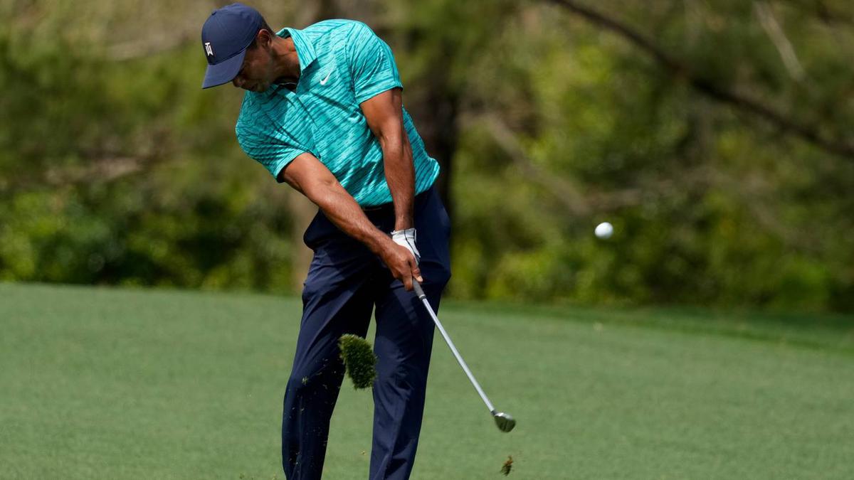 Tiger Woods' up-and-down day enough to make the cut as Scottie Scheffler leads after round two