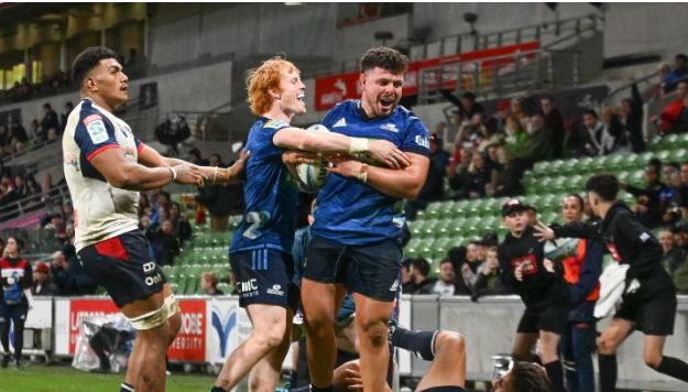 Blues bounce back with nine-try win over Rebels