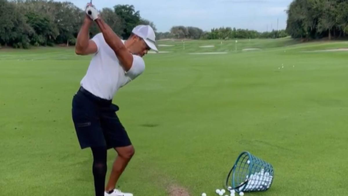 Tiger Woods back on the range after crash