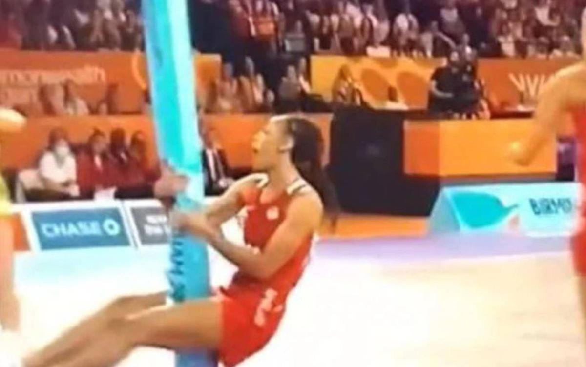 Wild scenes as star straddles and bends pole in netball semifinal