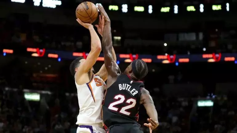 LOOK: Heat's Jimmy Butler blocks Devin Booker's potential game-winning shot to seal frantic comeback vs. Suns