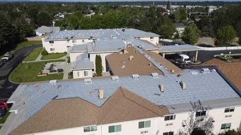 Commercial business roofing project Spokane Roofing experts adding new roof to large business 